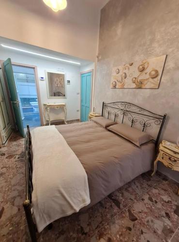 a bedroom with a large bed in a room at Dimora Valicenti in San Giorgio Lucano