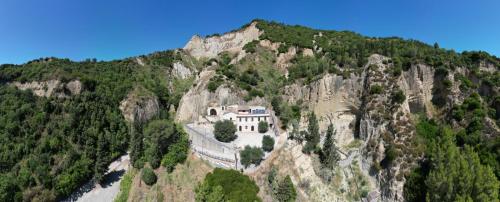 a house on the side of a mountain at Dimora Valicenti in San Giorgio Lucano