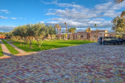 a car parked on the side of a brick road at Palais Noryalis in Tillouna
