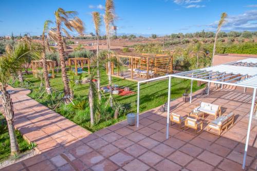 an overhead view of a patio with chairs and a playground at Palais Noryalis in Tillouna