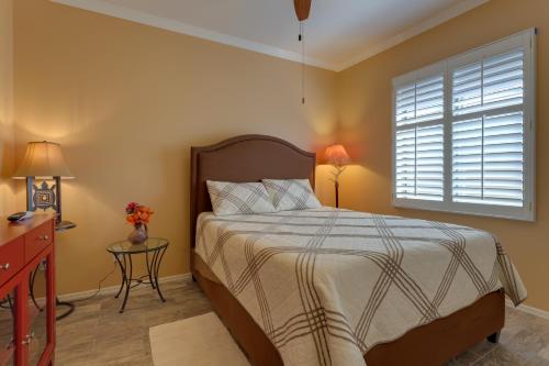 a bedroom with a bed and a window at Furnished Patio, Fire Pit Peaceful Anthem Home! in Anthem