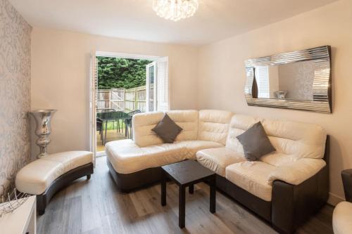 a living room with a couch and a chair at Host & Stay - Coventry Street in Wolverhampton