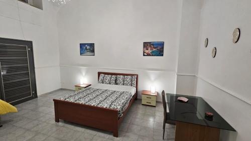 Ένα ή περισσότερα κρεβάτια σε δωμάτιο στο Un passo da Pompei