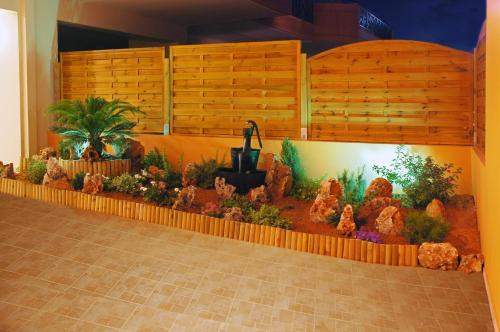 a display of plants and flowers on a wall at Philoxenia Hotel in Lefkandi Chalkidas