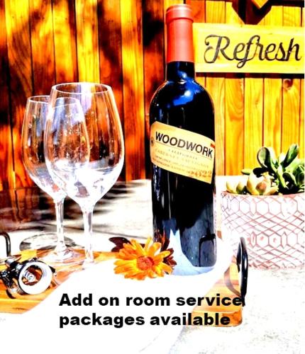 a bottle of wine and two glasses on a table at Reno Romantic Couples Retreat in Reno