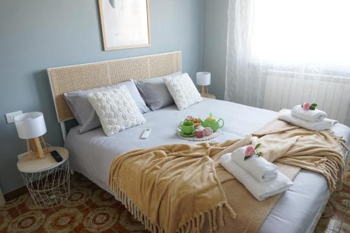 a bedroom with a bed with stuffed animals on it at Maria Pia apartment in Borghesiana 