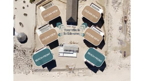 an overhead view of a beach with several buildings at Amina Wind Resort by Tasman in Salinas