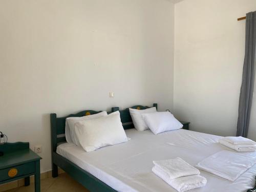 Ένα ή περισσότερα κρεβάτια σε δωμάτιο στο Κοχύλι