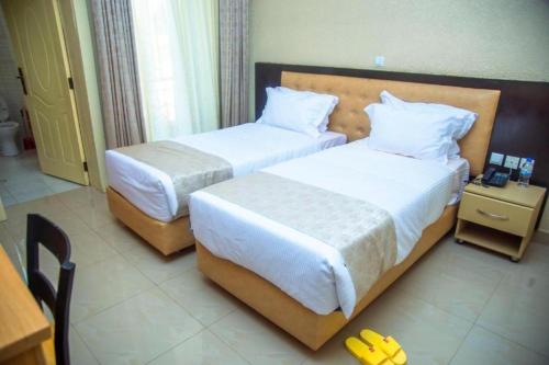 Ένα ή περισσότερα κρεβάτια σε δωμάτιο στο Quality Inn Motel Nyanza