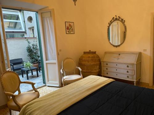 Ένα ή περισσότερα κρεβάτια σε δωμάτιο στο Le case di Marianna Bettona