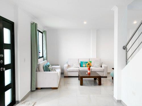 a living room with a couch and a table at Casa Napoli in Amalia