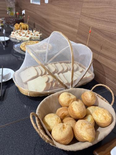 a plate of biscuits in a bowl on a table at Hotel LENA in São Luiz Gonzaga
