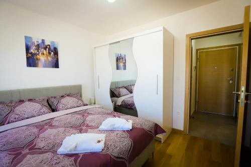 Postel nebo postele na pokoji v ubytování Apartman NN