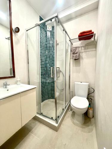 a bathroom with a shower and a toilet and a sink at Azur Studio Riviera Stay in Antibes