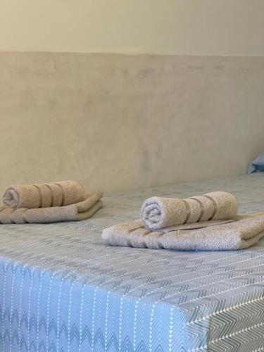 three pillows on a bed in a room at Alkionis Studio in Vari