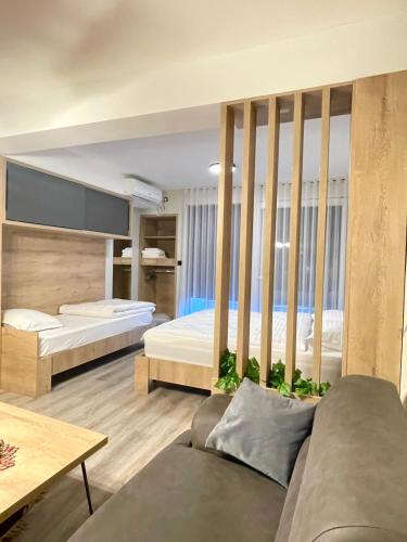Ένα ή περισσότερα κρεβάτια σε δωμάτιο στο Nessii Apartment