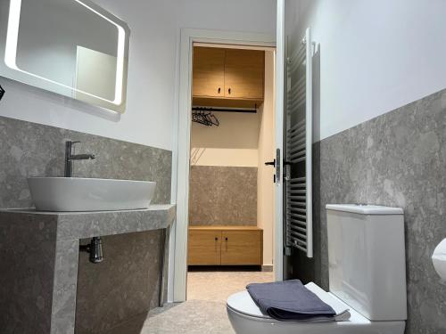 a bathroom with a sink and a toilet at POST VIEW Center Luxury Apartments 5 in Ioannina
