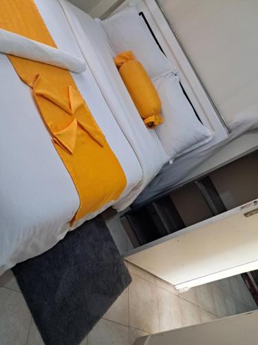 Ένα ή περισσότερα κρεβάτια σε δωμάτιο στο Damkit Homes Kitengela