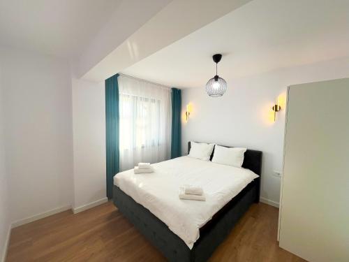 Ένα ή περισσότερα κρεβάτια σε δωμάτιο στο Confort ApartHotel Iasi