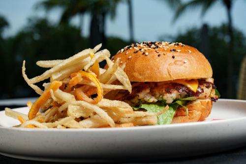 a sandwich and french fries on a white plate at Azulea Bacalar Hotel & Spa - Lagoon Front in Bacalar