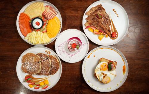 a group of plates of food on a table at Azulea Bacalar Hotel & Spa - Lagoon Front in Bacalar