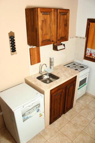 Kuchyň nebo kuchyňský kout v ubytování Litoral Apart