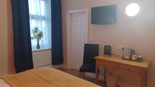 Un ou plusieurs lits dans un hébergement de l'établissement The Renishaw Rooms