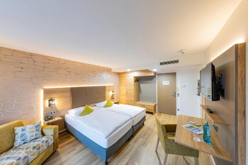 Una cama o camas en una habitación de Ringhotel Drees