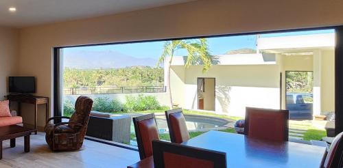 a living room with a large sliding glass door with a view at Casa Vista Animas San Jose del Cabo in San José del Cabo