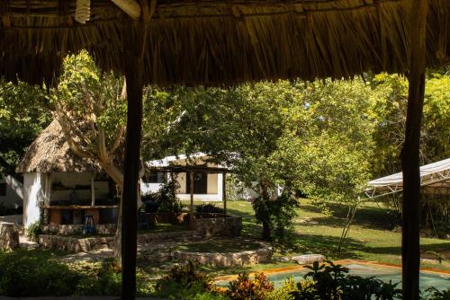 a view of the house from the garden at El Prado- Rancho familiar en Yucatán in Xocchel
