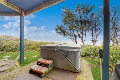a small appliance sitting on the ground in a yard at Waive Time in Lincoln City