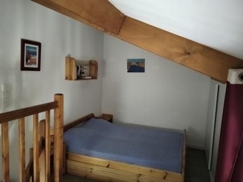 A bed or beds in a room at Maison