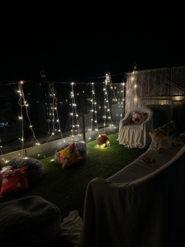 a room with two beds and lights on the ground at Hotel Tulsi Inn in Haldwāni