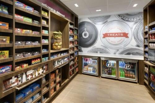 a grocery store aisle with products on the walls at Hampton Inn & Suites Richmond Short Pump, Va in Richmond