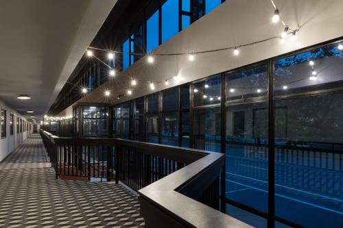 a swimming pool in a building with lights at The Arcadian in Brookline
