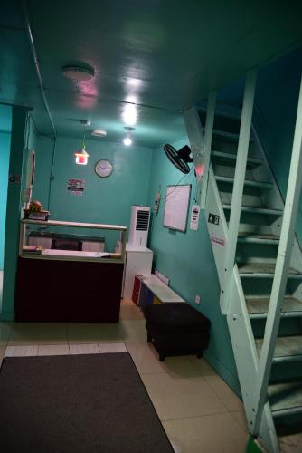 a room with a staircase in a hospital room at Wind Stay in Male City