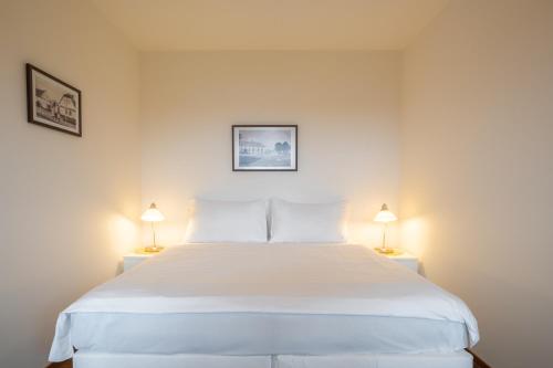 Postel nebo postele na pokoji v ubytování Rooms & Restaurace Na Jitrách