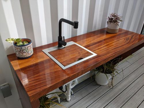 a wooden table with a sink on top of it at Brand New! Black Sand Beach-Casa NoSe' in Vieques