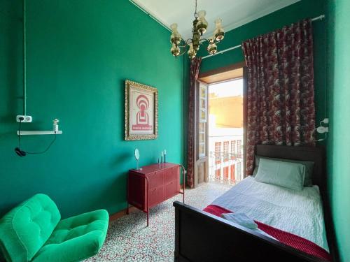 Ένα ή περισσότερα κρεβάτια σε δωμάτιο στο Hostal Bubango