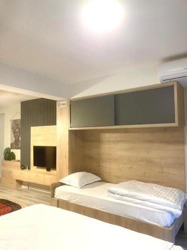 Ένα ή περισσότερα κρεβάτια σε δωμάτιο στο Nessii Apartment
