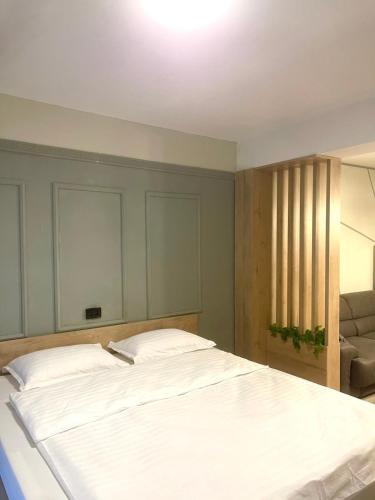 Ένα ή περισσότερα κρεβάτια σε δωμάτιο στο Nessii Apartment