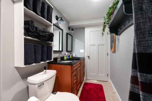 a bathroom with a white toilet and a sink at Glenn Meadow Bed and Breakfast in South Haven