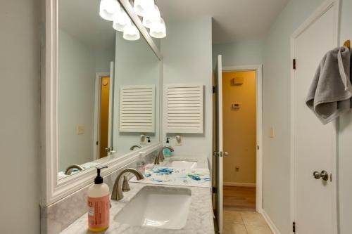 a bathroom with a sink and a large mirror at Downtown Home with Yard and BBQ - 6 Mi to Downtown! in Beaufort