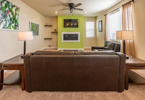 a living room with a couch and a table at Newly Built 4BR Spacious Retreat in Peyton in Peyton