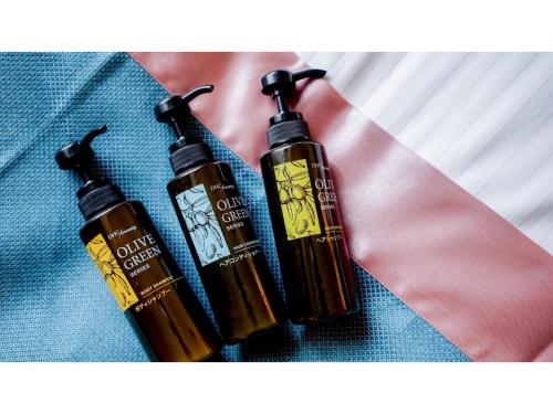 two bottles of essential oils sitting on top of apron at Hotel Area One Ise Inter - Vacation STAY 38393v in Ise