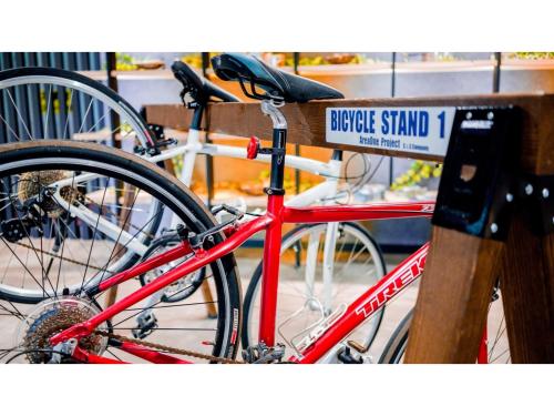 a red bike parked next to a sign on a bench at Hotel Area One Ise Inter - Vacation STAY 38393v in Ise