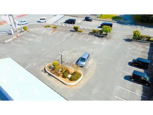 a parking lot with a car parked in it at Hotel Area One Ise Inter - Vacation STAY 38393v in Ise