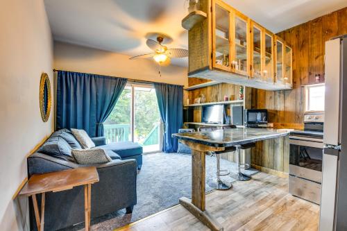 a kitchen and living room with a couch and a table at Charming New York Retreat with Lake Champlain Views! in Alburg