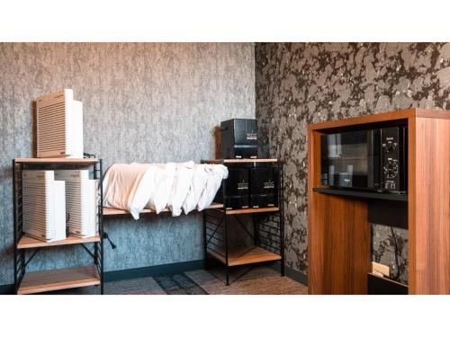 a room with a coffee maker and a microwave at Hotel Area One Ise Inter - Vacation STAY 38519v in Ise