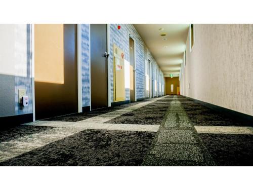 an empty hallway in a school building with a hallway at Hotel Area One Ise Inter - Vacation STAY 38519v in Ise
